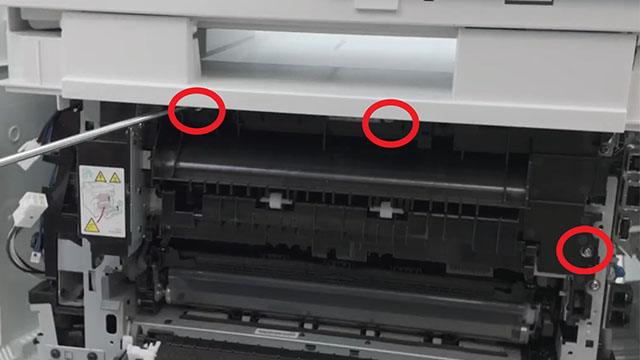 the placement of the three screws on the fuser cover