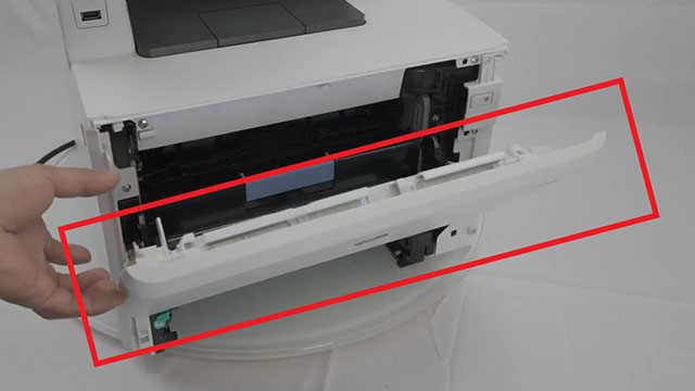 opening the front door assembly on a hp m452