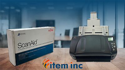 Fujitsu ScanAid kit and Fujitsu scanner displayed on a table with Item, Inc. logo at the bottom.