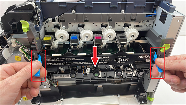 pulling up latches from imaging kit to remove from a xerox c315 printer