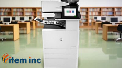 HP Color LaserJet Managed Flow MFP E87640z multifunction printer in a library, with the Item Inc logo displayed in the corner.